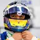 SINGAPORE, SINGAPORE - OCTOBER 04: Isack Hadjar of France and Visa Cash App Racing Bulls prepares to drive in the garage during qualifying ahead of the F1 Grand Prix of Singapore at Marina Bay Street Circuit on October 04, 2025 in Singapore, Singapore. (Photo by Rudy Carezzevoli/Getty Images)