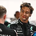 SINGAPORE, SINGAPORE - OCTOBER 04: Pole position qualifier George Russell of Great Britain and Mercedes AMG Petronas F1 Team in parc ferme during qualifying ahead of the F1 Grand Prix of Singapore at Marina Bay Street Circuit on October 04, 2025 in Singapore, Singapore. (Photo by Rudy Carezzevoli/Getty Images)