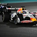 ABU DHABI, UNITED ARAB EMIRATES - DECEMBER 07: Isack Hadjar of France driving the (6) Visa Cash App Racing Bulls VCARB 02 leads Carlos Sainz of Spain driving the (55) Williams FW47 Mercedes on track during the F1 Grand Prix of Abu Dhabi at Yas Marina Circuit on December 07, 2025 in Abu Dhabi, United Arab Emirates. (Photo by James Sutton - Formula 1/Formula 1 via Getty Images)