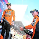 SPIELBERG, AUSTRIA - JUNE 29: Race winner Lando Norris of Great Britain and McLaren and Second placed Oscar Piastri of Australia and McLaren celebrate on the podium with Champagne during the F1 Grand Prix of Austria at Red Bull Ring on June 29, 2025 in Spielberg, Austria. (Photo by Mark Sutton - Formula 1/Formula 1 via Getty Images)