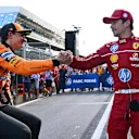 SPIELBERG, AUSTRIA - JUNE 28: Second placed qualifier Charles Leclerc of Monaco and Scuderia Ferrari and Third placed qualifier Oscar Piastri of Australia and McLaren congratulate each other in parc ferme during qualifying ahead of the F1 Grand Prix of Austria at Red Bull Ring on June 28, 2025 in Spielberg, Austria. (Photo by Mark Sutton - Formula 1/Formula 1 via Getty Images)