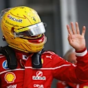BAKU, AZERBAIJAN - SEPTEMBER 20: Twelfth placed qualifier Lewis Hamilton of Great Britain and Scuderia Ferrari waves from the pitlane during qualifying ahead of the F1 Grand Prix of Azerbaijan at Baku City Circuit on September 20, 2025 in Baku, Azerbaijan. (Photo by Bryn Lennon - Formula 1/Formula 1 via Getty Images)
