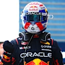 BAKU, AZERBAIJAN - SEPTEMBER 20: Pole position qualifier Max Verstappen of the Netherlands and Oracle Red Bull Racing celebrates on arrival in parc ferme during qualifying ahead of the F1 Grand Prix of Azerbaijan at Baku City Circuit on September 20, 2025 in Baku, Azerbaijan. (Photo by Bryn Lennon - Formula 1/Formula 1 via Getty Images)