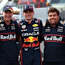 BAKU, AZERBAIJAN - SEPTEMBER 20: Pole position qualifier Max Verstappen of the Netherlands and Oracle Red Bull Racing celebrates in parc ferme with his team during qualifying ahead of the F1 Grand Prix of Azerbaijan at Baku City Circuit on September 20, 2025 in Baku, Azerbaijan. (Photo by Mark Thompson/Getty Images)