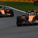 SPA, BELGIUM - JULY 27: Oscar Piastri of Australia driving the (81) McLaren MCL39 Mercedes leads Lando Norris of Great Britain driving the (4) McLaren MCL39 Mercedes on track during the F1 Grand Prix of Belgium at Circuit de Spa-Francorchamps on July 27, 2025 in Spa, Belgium. (Photo by Alex Bierens de Haan/Getty Images)