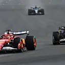 SPA, BELGIUM - JULY 27: Charles Leclerc of Monaco driving the (16) Scuderia Ferrari SF-25 leads Max Verstappen of the Netherlands driving the (1) Oracle Red Bull Racing RB21 and George Russell of Great Britain driving the (63) Mercedes AMG Petronas F1 Team W16 on track during the F1 Grand Prix of Belgium at Circuit de Spa-Francorchamps on July 27, 2025 in Spa, Belgium. (Photo by Mark Sutton - Formula 1/Formula 1 via Getty Images)