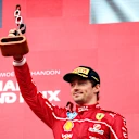 SPA, BELGIUM - JULY 27: Third placed Charles Leclerc of Monaco and Scuderia Ferrari celebrates on the podium during the F1 Grand Prix of Belgium at Circuit de Spa-Francorchamps on July 27, 2025 in Spa, Belgium. (Photo by Clive Rose - Formula 1/Formula 1 via Getty Images)