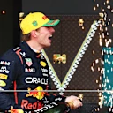 SAO PAULO, BRAZIL - NOVEMBER 09: Third placed Max Verstappen of the Netherlands and Oracle Red Bull Racing celebrates on the podium with Champagne during the F1 Grand Prix of Brazil at Autodromo Jose Carlos Pace on November 09, 2025 in Sao Paulo, Brazil. (Photo by Mark Thompson/Getty Images)