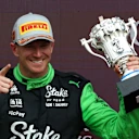NORTHAMPTON, ENGLAND - JULY 06: Third placed Nico Hulkenberg of Germany and Stake F1 Team Kick Sauber on the podium with his trophy during the F1 Grand Prix of Great Britain at Silverstone Circuit on July 06, 2025 in Northampton, England. (Photo by Clive Rose/Getty Images)