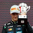 NORTHAMPTON, ENGLAND - JULY 06: Second placed Oscar Piastri of Australia and McLaren on the podium with his trophy during the F1 Grand Prix of Great Britain at Silverstone Circuit on July 06, 2025 in Northampton, England. (Photo by Clive Rose/Getty Images)
