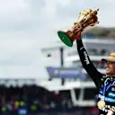 NORTHAMPTON, ENGLAND - JULY 06: Race winner Lando Norris of Great Britain and McLaren on the podium with his trophy during the F1 Grand Prix of Great Britain at Silverstone Circuit on July 06, 2025 in Northampton, England. (Photo by Mario Renzi - Formula 1/Formula 1 via Getty Images)