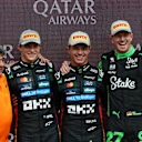 NORTHAMPTON, ENGLAND - JULY 06: Race winner Lando Norris of Great Britain and McLaren Second placed Oscar Piastri of Australia and McLaren Third placed Nico Hulkenberg of Germany and Stake F1 Team Kick Sauber and Peter Prodromou, Technical Director (Aerodynamics), McLaren on the podium during the F1 Grand Prix of Great Britain at Silverstone Circuit on July 06, 2025 in Northampton, England. (Photo by Mark Thompson/Getty Images)