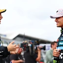 NORTHAMPTON, ENGLAND - JULY 05: Second placed qualifier Oscar Piastri of Australia and McLaren and Third placed qualifier Lando Norris of Great Britain and McLaren talk in parc ferme during qualifying ahead of the F1 Grand Prix of Great Britain at Silverstone Circuit on July 05, 2025 in Northampton, England. (Photo by Bryn Lennon - Formula 1/Formula 1 via Getty Images)