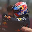 NORTHAMPTON, ENGLAND - JULY 05: Pole position qualifier Max Verstappen of the Netherlands and Oracle Red Bull Racing celebrates with a teammate in parc ferme during qualifying ahead of the F1 Grand Prix of Great Britain at Silverstone Circuit on July 05, 2025 in Northampton, England. (Photo by Rudy Carezzevoli/Getty Images)
