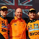 BUDAPEST, HUNGARY - AUGUST 03: Race winner Lando Norris of Great Britain and McLaren Second placed Oscar Piastri of Australia and McLaren and Mark Ingham, Head of Design at McLaren on the podium during the F1 Grand Prix of Hungary at Hungaroring on August 03, 2025 in Budapest, Hungary. (Photo by Clive Rose/Getty Images)