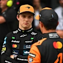 BUDAPEST, HUNGARY - AUGUST 02: Second placed qualifier Oscar Piastri of Australia and McLaren and Third placed qualifier Lando Norris of Great Britain and McLaren talk in parc ferme during qualifying ahead of the F1 Grand Prix of Hungary at Hungaroring on August 02, 2025 in Budapest, Hungary. (Photo by Rudy Carezzevoli/Getty Images)