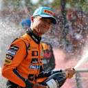 MONZA, ITALY - SEPTEMBER 07: Second placed Lando Norris of Great Britain and McLaren celebrates with Champagne on the podium during the F1 Grand Prix of Italy at Autodromo Nazionale Monza on September 07, 2025 in Monza, Italy. (Photo by Bryn Lennon - Formula 1/Formula 1 via Getty Images)