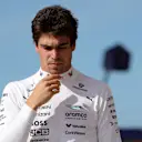 MONZA, ITALY - SEPTEMBER 06: Seventeenth placed qualifier Lance Stroll of Canada and Aston Martin F1 Team walks in the Pitlane during qualifying ahead of the F1 Grand Prix of Italy at Autodromo Nazionale Monza on September 06, 2025 in Monza, Italy. (Photo by Bryn Lennon - Formula 1/Formula 1 via Getty Images)
