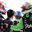 MONZA, ITALY - SEPTEMBER 06: Eighth placed qualifier Gabriel Bortoleto of Brazil and Stake F1 Team Kick Sauber congratulates Pole position qualifier Max Verstappen of the Netherlands and Oracle Red Bull Racing in parc ferme during qualifying ahead of the F1 Grand Prix of Italy at Autodromo Nazionale Monza on September 06, 2025 in Monza, Italy. (Photo by Bryn Lennon - Formula 1/Formula 1 via Getty Images)