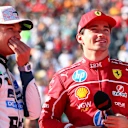 MEXICO CITY, MEXICO - OCTOBER 26: Race winner Lando Norris of Great Britain and McLaren and Second placed Charles Leclerc of Monaco and Scuderia Ferrari talk in parc ferme during the F1 Grand Prix of Mexico at Autodromo Hermanos Rodriguez on October 26, 2025 in Mexico City, Mexico. (Photo by Bryn Lennon - Formula 1/Formula 1 via Getty Images)