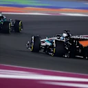 LUSAIL CITY, QATAR - NOVEMBER 30: Fernando Alonso of Spain driving the (14) Aston Martin F1 Team AMR25 Mercedes leads George Russell of Great Britain driving the (63) Mercedes AMG Petronas F1 Team W16 on track during the F1 Grand Prix of Qatar at Lusail International Circuit on November 30, 2025 in Lusail City, Qatar. (Photo by Clive Rose - Formula 1/Formula 1 via Getty Images)