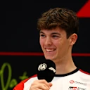 LUSAIL CITY, QATAR - NOVEMBER 27: Oliver Bearman of Great Britain and Haas F1 speaks in the Drivers Press Conference during previews ahead of the F1 Grand Prix of Qatar at Lusail International Circuit on November 27, 2025 in Lusail City, Qatar. (Photo by Clive Rose/Getty Images)