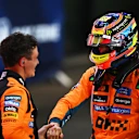 LUSAIL CITY, QATAR - NOVEMBER 29: Sprint winner Oscar Piastri of Australia and McLaren and Third placed Lando Norris of Great Britain and McLaren congratulate each other in parc ferme during the Sprint ahead of the F1 Grand Prix of Qatar at Lusail International Circuit on November 29, 2025 in Lusail City, Qatar. (Photo by Rudy Carezzevoli/Getty Images)