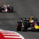 AUSTIN, TEXAS - OCTOBER 19: Yuki Tsunoda of Japan driving the (22) Oracle Red Bull Racing RB21 leads Oliver Bearman of Great Britain driving the (87) Haas F1 VF-25 Ferrari on track during the F1 Grand Prix of United States at Circuit of The Americas on October 19, 2025 in Austin, Texas. (Photo by Clive Rose/Getty Images)