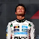 AUSTIN, TEXAS - OCTOBER 19: Second placed Lando Norris of Great Britain and McLaren on the podium during the F1 Grand Prix of United States at Circuit of The Americas on October 19, 2025 in Austin, Texas. (Photo by Clive Rose/Getty Images)