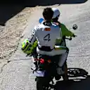 AUSTIN, TEXAS - OCTOBER 18: Lando Norris of Great Britain and McLaren on the back of a moped during the Sprint ahead of the F1 Grand Prix of United States at Circuit of The Americas on October 18, 2025 in Austin, Texas. (Photo by Mark Thompson/Getty Images)