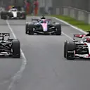 MELBOURNE, AUSTRALIA - MARCH 08: Esteban Ocon of France driving the (31) Haas F1 VF-26 Ferrari and Max Verstappen of the Netherlands driving the (3) Oracle Red Bull Racing RB22 Red Bull Ford battle for track position during the F1 Grand Prix of Australia at Albert Park Grand Prix Circuit on March 08, 2026 in Melbourne, Australia. (Photo by James Sutton - Formula 1/Formula 1 via Getty Images)