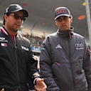 SHANGHAI, CHINA - MARCH 15: Sergio Perez of Mexico and Cadillac F1 Team and Gabriel Bortoleto of Brazil and Audi F1 Team talk on the drivers parade prior to the F1 Grand Prix of China at Shanghai International Circuit on March 15, 2026 in Shanghai, China. (Photo by Alex Bierens de Haan/Getty Images)