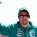 SUZUKA, JAPAN - MARCH 29: Fernando Alonso of Spain and Aston Martin F1 Team waves on the drivers