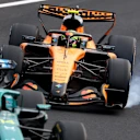 SUZUKA, JAPAN - MARCH 29: Lando Norris of Great Britain driving the (1) McLaren MCL40 Mercedes locks a wheel under braking during the F1 Grand Prix of Japan at Suzuka Circuit on March 29, 2026 in Suzuka, Japan. (Photo by Clive Mason/Getty Images)
