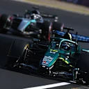 SUZUKA, JAPAN - MARCH 27: Sparks fly behind Lance Stroll of Canada driving the (18) Aston Martin F1 Team AMR26 Honda on track during practice ahead of the F1 Grand Prix of Japan at Suzuka Circuit on March 27, 2026 in Suzuka, Japan. (Photo by Clive Mason/Getty Images)