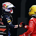 MONTREAL, QUEBEC - MAY 24: Second placed Lewis Hamilton of Great Britain and Scuderia Ferrari and Third placed Max Verstappen of the Netherlands and Oracle Red Bull Racing congratulate each other in parc ferme during the F1 Grand Prix of Canada at Circuit Gilles-Villeneuve on May 24, 2026 in Montreal, Quebec. (Photo by Mark Thompson/Getty Images)
