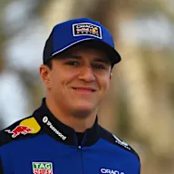 BAHRAIN, BAHRAIN - FEBRUARY 11: Isack Hadjar of France and Oracle Red Bull Racing walks in the