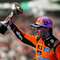 SUZUKA, JAPAN - MARCH 29: Second placed Oscar Piastri of Australia and McLaren lifts his trophy on
