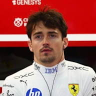 SUZUKA, JAPAN - MARCH 27: Charles Leclerc of Monaco and Scuderia Ferrari looks on in the garage