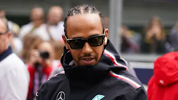 MEXICO CITY, MEXICO - OCTOBER 26: Lewis Hamilton of Great Britain and Mercedes walks in the Paddock