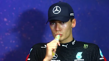 LE CASTELLET, FRANCE - JULY 24: Third placed George Russell of Great Britain and Mercedes eats an