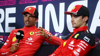 SINGAPORE, SINGAPORE - SEPTEMBER 16: Pole position qualifier Carlos Sainz of Spain and Ferrari