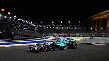 SINGAPORE, SINGAPORE - SEPTEMBER 21: Fernando Alonso of Spain driving the (14) Aston Martin AMR24