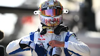 MELBOURNE, AUSTRALIA - MARCH 23: 18th placed qualifier Daniel Ricciardo of Australia and Visa Cash