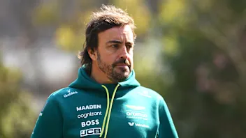 SHANGHAI, CHINA - MARCH 20: Fernando Alonso of Spain and Aston Martin F1 Team walks in the Paddock