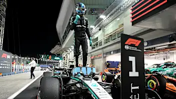 SINGAPORE, SINGAPORE - OCTOBER 04: Pole position qualifier George Russell of Great Britain and
