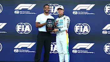 MEXICO CITY, MEXICO - OCTOBER 25: Rome Flynn presents Pole position qualifier Lando Norris of Great