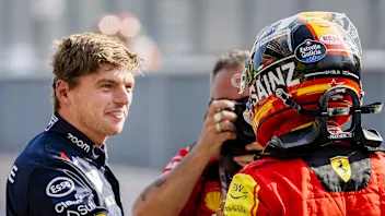 MONZA - Max Verstappen (Red Bull Racing) congratulates Carlos Sainz (Ferrari) on achieving pole