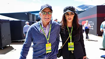 NORTHAMPTON, ENGLAND - JULY 7: Michael Douglas and Catherine Zeta-Jones walk in the paddock during