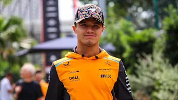 SINGAPORE, SINGAPORE - SEPTEMBER 20: Lando Norris of Great Britain and McLaren walks in the paddock